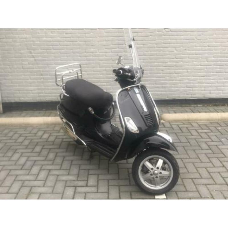 Vespa S blauw kenteken