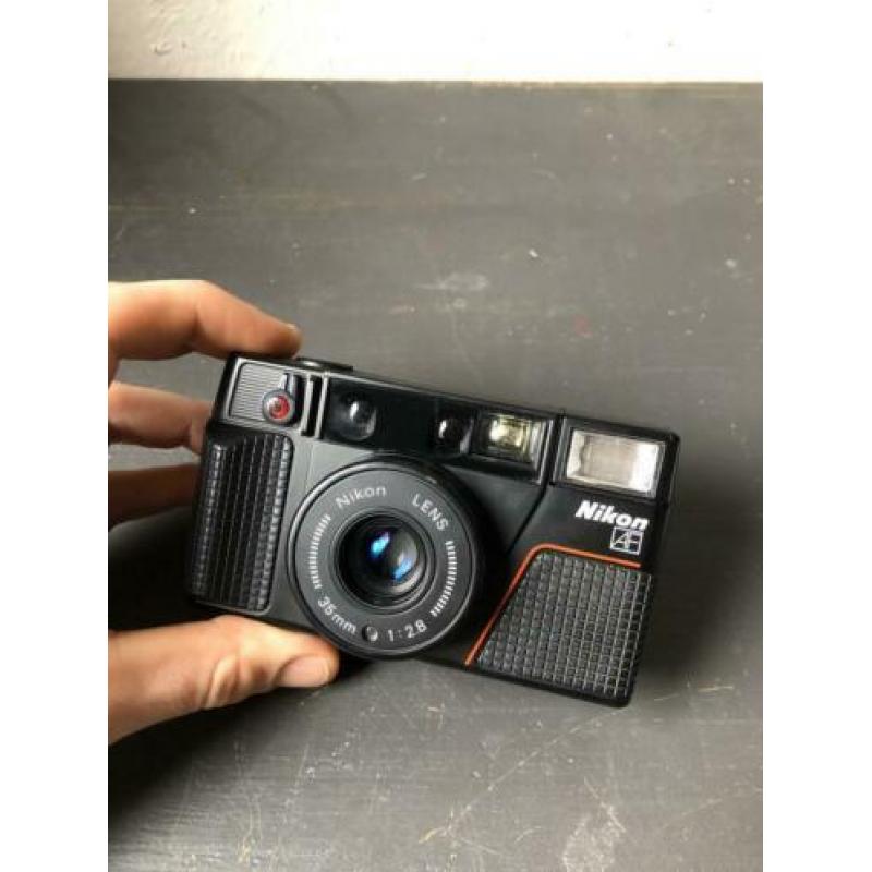 Nikon L35 AF2 point & shoot camera (stuck shutterbutton)