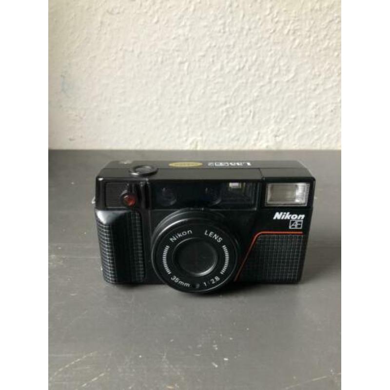 Nikon L35 AF2 point & shoot camera (stuck shutterbutton)