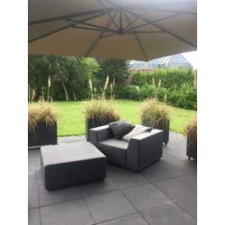 Luxe loungestoel met hocker